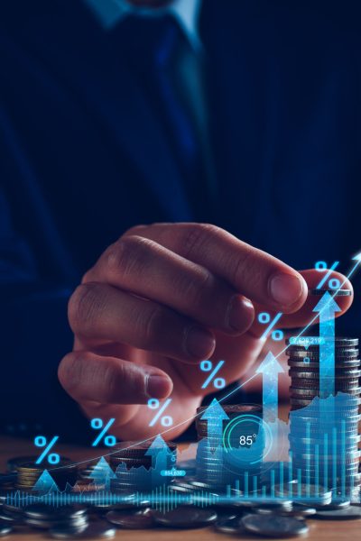 Interest rate and dividend concept. Businessman with percentage symbol and up arrow, Interest rates continue to increase, return on stocks and mutual funds, long term investment for retirement. Interest rate and dividend concept. Businessman with percentage symbol and up arrow, Interest rates continue to increase, return on stocks and mutual funds, long term investment for retirement.